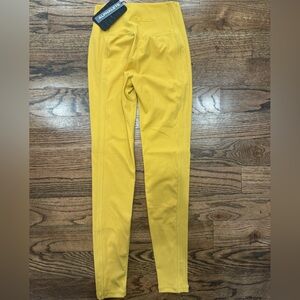 ALPHALETE women’s leggings size small yellow